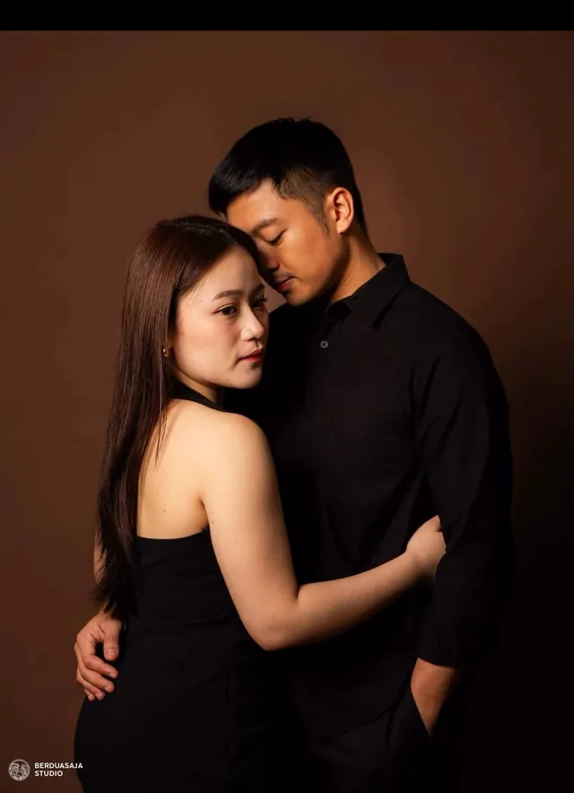 Couple portrait on a warm brown backdrop