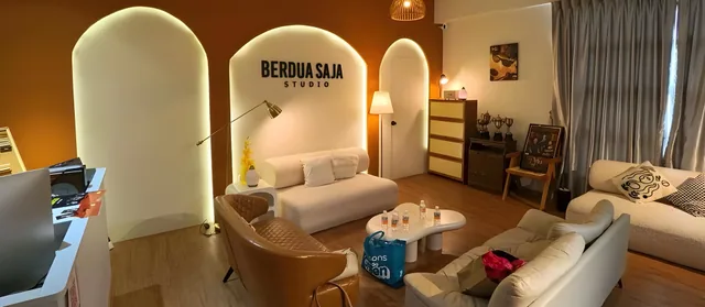 The BerduaSaja Studio lounge: arched alcoves, warm lamps and cream sofas